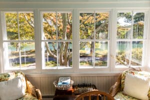 Large window with trees and water views